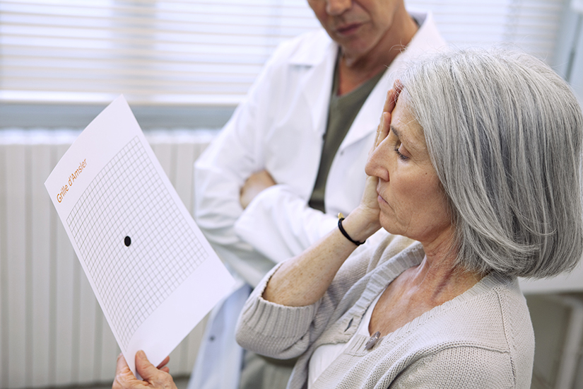 woman using amsler grid to look for amd